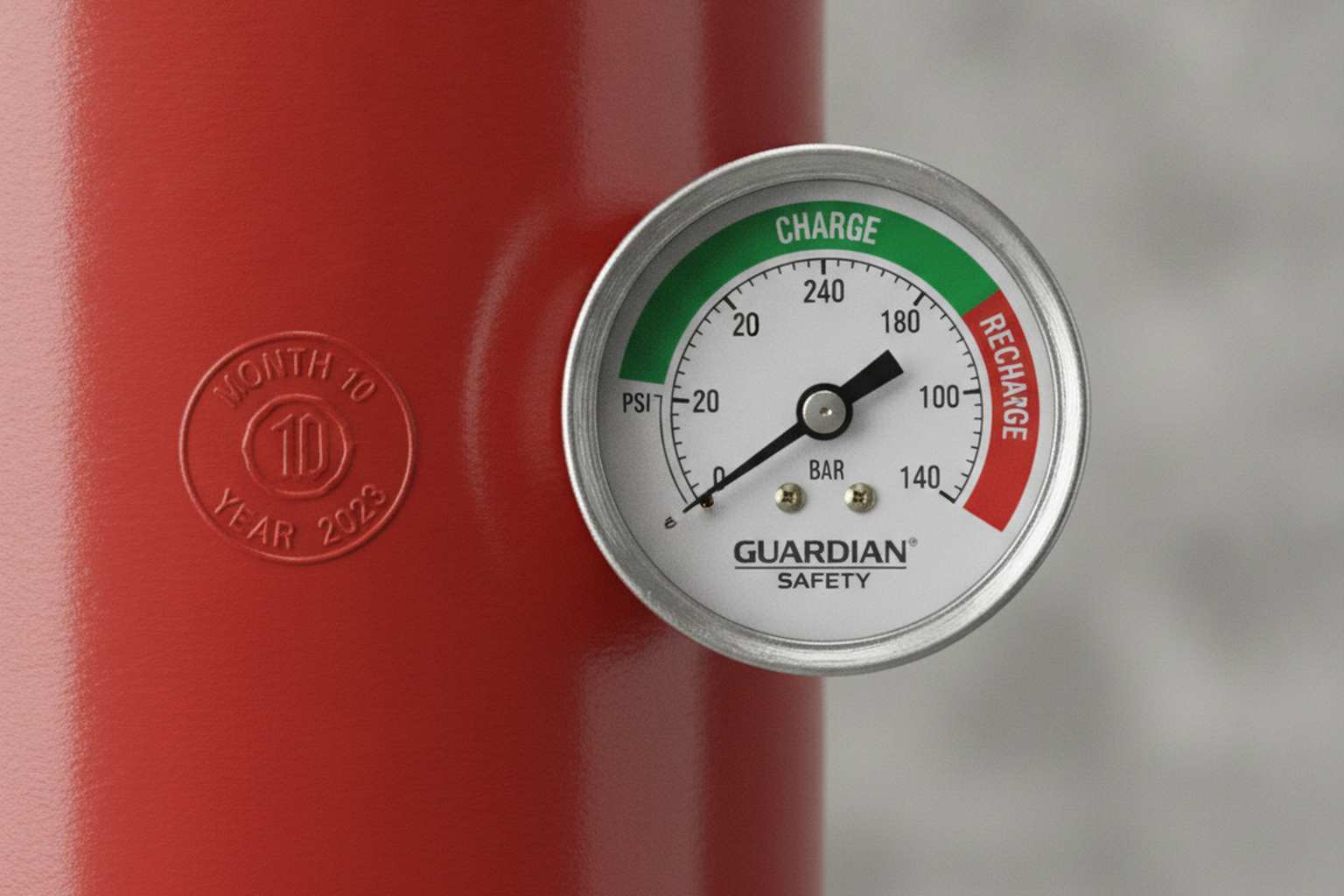 Close-up of fire extinguisher pressure gauge showing green zone with manufacture date stamp